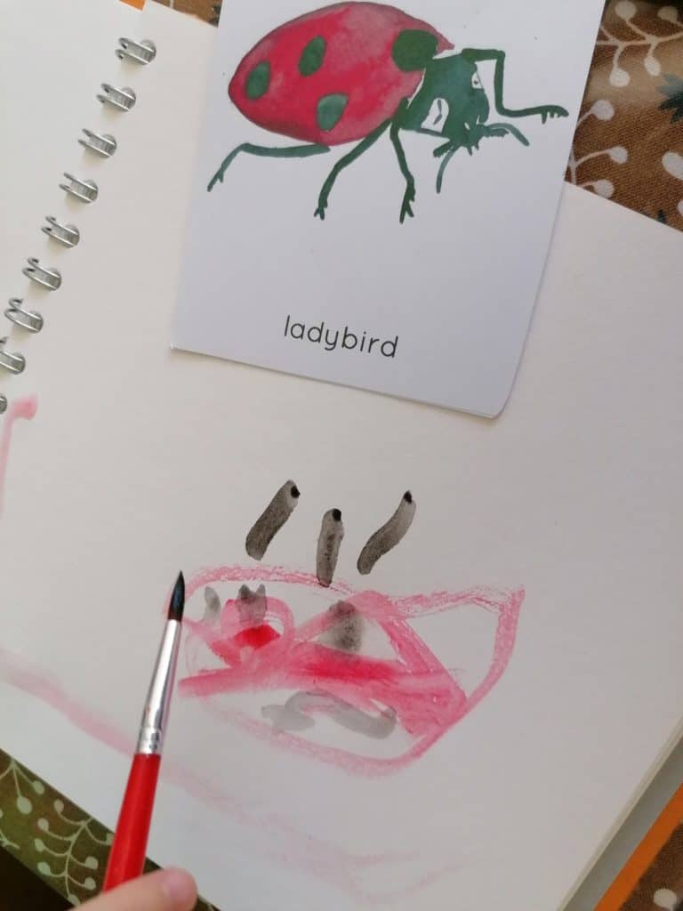 Nature journal of a ladybird water colour painted by three year old Floss