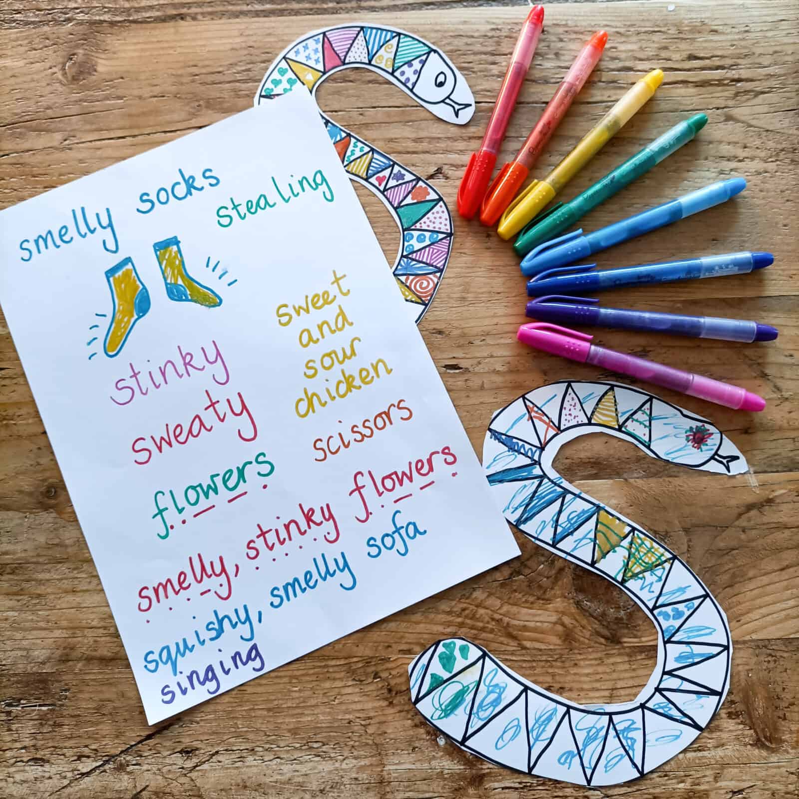 Pinterest Pin for learning Phonics Pahse 2 's' with 's' words, glitter pens and 's' snakes decorated from paper