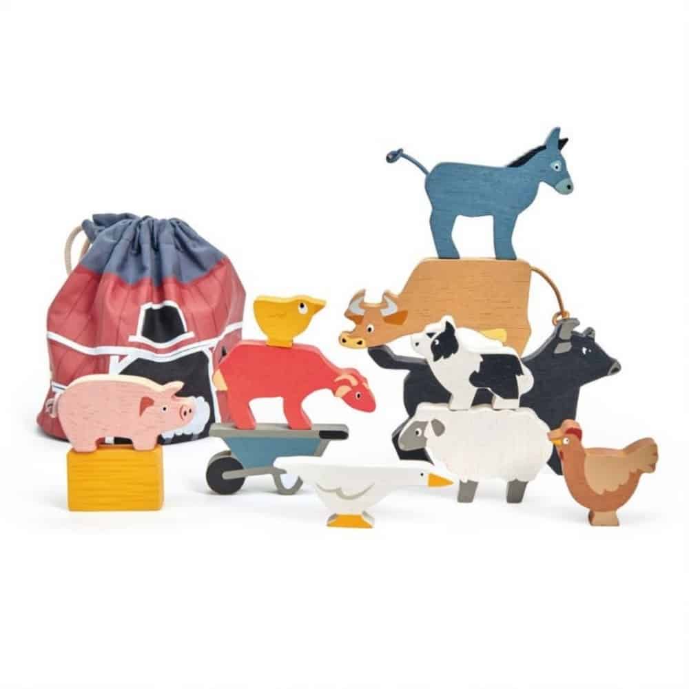 Stacking wooden farm animal toys with a fabric drawstring bag.