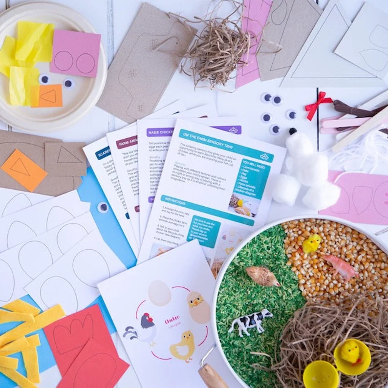A selection of craft items and sensory play farm items.