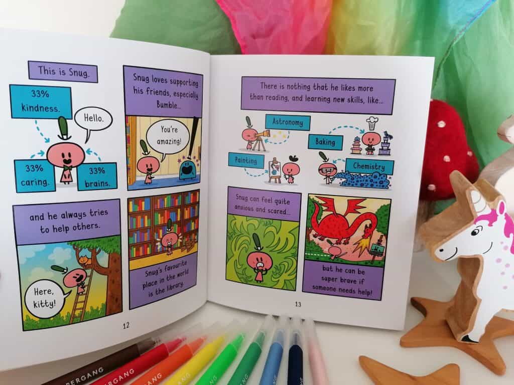 Bumble and Snug graphic novel book the Excited Unicorn inside page spread infront of a rainbow play silk and next to wooden unicorns. 