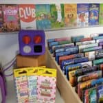 Colourful children's books and educational toys, including Ladybird Audio Adventures and Zoe and Sassafras series, designed to promote early learning and literacy skills.